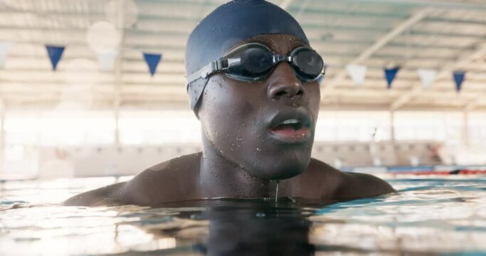 Tired, black man and sport with face in swimming pool for cardio workout and endurance practice for race or competition. Fitness, male person and swimmer in water for fresh air after speed training