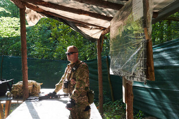 The esteemed leader of an elite military unit, strategic brilliance unfolds as he meticulously...