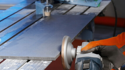 Close up of a worker polishing a cabinet door in a furniture factory. Creative. Industrial...