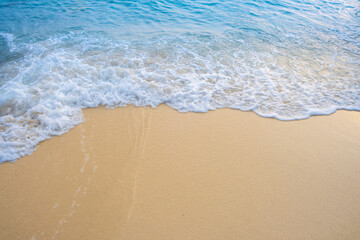 Nature of the beach and sea Summer with sunshine, sandy beaches, clear blue waters sparkling against the blue sky. On an island with good ecology and environment Background for summer vacation