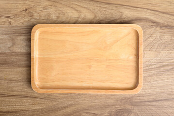 A wooden plate on wooden background, Kitchen utensil, Table top view