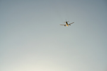 Passenger jet airplane take off from an airport in the evening.