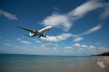 Landing passenger jet airplane at daytime.
