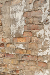 Old, broken brick wall texture. Abandoned, ruined building in Latvia, Europe. Artistic wall texture.
