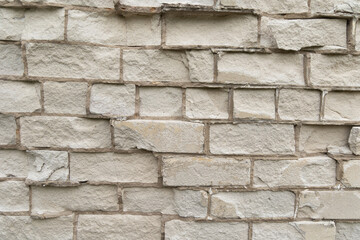 Old, broken brick wall texture. Abandoned, ruined building in Latvia, Europe. Artistic wall texture.