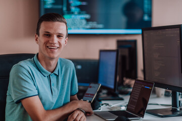 A programmer diligently testing smartphone applications while sitting in their office.