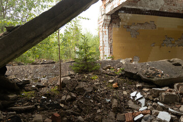 The ruins of building in old soviet army base in Latvia, Europe. Collapsed house.