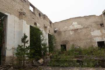 The ruins of building in old soviet army base in Latvia, Europe. Collapsed house.