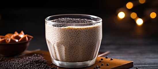 A vegan friendly chia pudding made with black chia seeds and soya milk presented in a simple manner with a copy space image