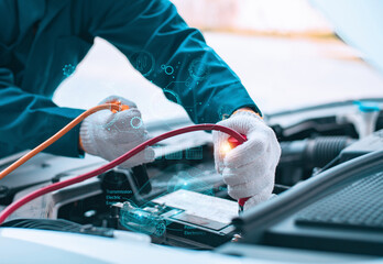Close-up of a mechanic in gloves inspecting an electric car's battery system with digital interface...