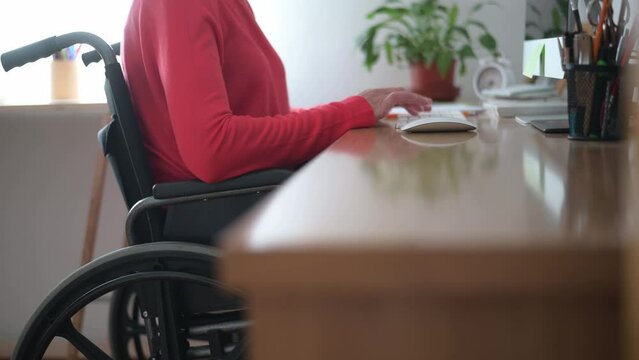 Disabled Woman Working At Her Desk At Home, Using A Desktop Computer. Image That Highlights The Importance Of Accessibility And Labor Inclusion.