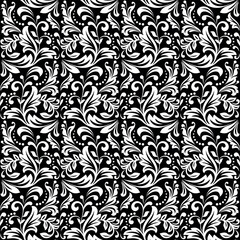 Floral pattern. Vintage wallpaper in the Baroque style. Seamless vector background. White and black ornament for fabric, wallpaper, packaging. Ornate Damask flower ornament.