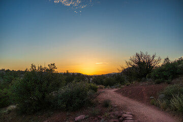Sunset in the desert with hiking trail