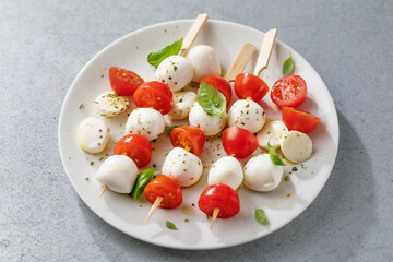 Caprese salad served on plate