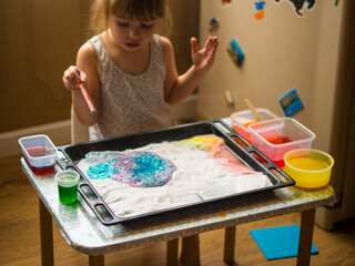 a child makes experiments with chemicals. experiments with soda and citric acid