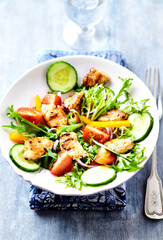 Healthy Salad with Chicken Breast, Cherry Tomatoes, Cucumber, Orange Pepper, Endive and Red Onion. Close up.