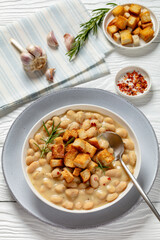 rosemary garlic creamy white bean soup in bowl