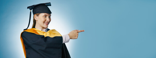 Pointing, graduation and banner of woman in studio for university, college and mockup announcement....