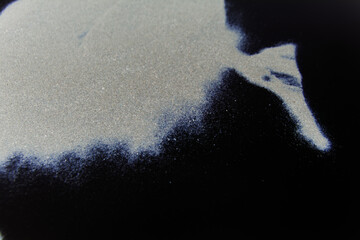 abstract white dust on a black background.