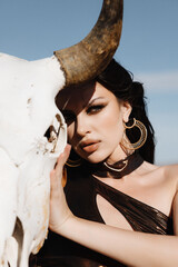 girl in a swimsuit in the desert, fashion beauty girl in the desert, A girl holds a buffalo skull