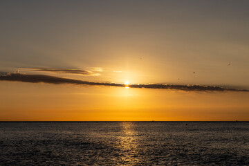 Fototapeta premium Sunrise over the Mediterranean Sea seen from the beach in Torremolinos. Costa del Sol, Spain
