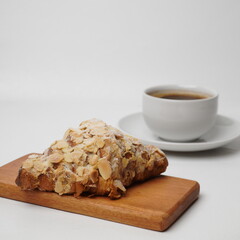 Almond croissant isolated on a white background
