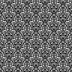 Floral pattern. Vintage wallpaper in the Baroque style. Seamless vector background. White and black ornament for fabric, wallpaper, packaging. Ornate Damask flower ornament.