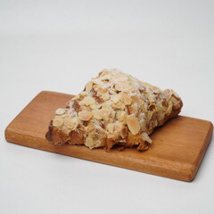 Almond croissant isolated on a white background
