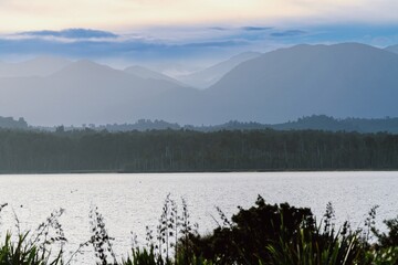Lake Mahinapua and a view to the Southern Alps, Hokitika, West Coast, New Zealand.