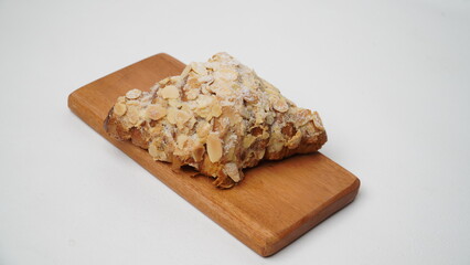Almond croissant isolated on a white background
