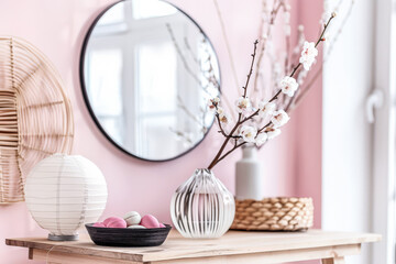 Zen minimalist interiors with pink tones, minimal furniture and natural decor.