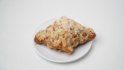 Almond croissant isolated on a white background
