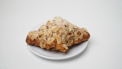 Almond croissant isolated on a white background
