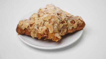 Almond croissant isolated on a white background
