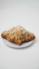 Almond croissant isolated on a white background
