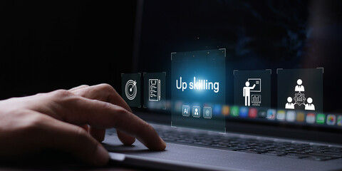 Upskilling concept. Businessman touching skills icon on virtual screen. Learning new and enhanced...