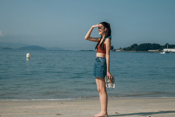 young woman scanning the horizon
