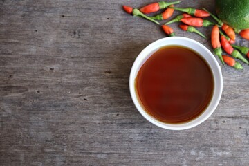 Fish sauce with red chili on wood table