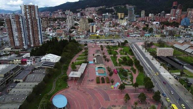 Aerial view flying over the Parque Renacimiento park in cloudy Bogota, Colombia