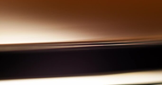 Macro closup of edge of a vinyl on a record player platter spinning and the stopping