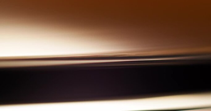Macro closup of edge of a vinyl on a record player platter starting, spinning, and the stopping