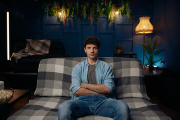 Man lounges on a comfortable couch