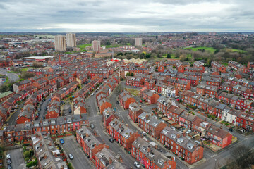 Aerial photo of the town of Kirkstall in Leeds West Yorkshire in the UK, showing a drone view of the suburban houses and neighbourhood from above on a sunny day in the autumn time