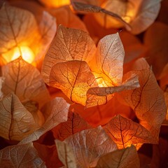 Fototapeta premium Brightly Lit, Glowing Autumn Leaves Cluster Together in Soft Light