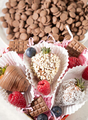 chocolate covered strawberries  and chocolate flakes 