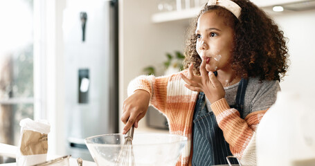 Girl, baking and taste in kitchen or house with batter, home and motor skills or childhood...