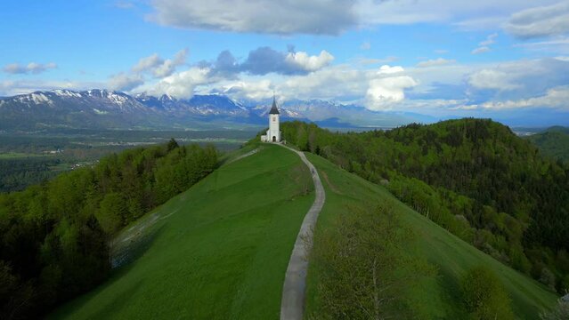 A beautiful aerial view of the Slovenian landscape around the Jamnik Church