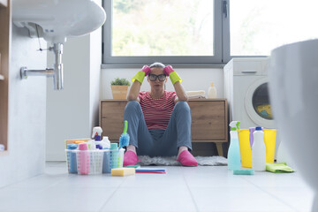 Frustrated woman cleaning up her home