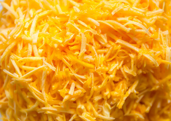 Grated fresh raw pumpkin prepared for cooking. Healthy vegetarian food ingredient.