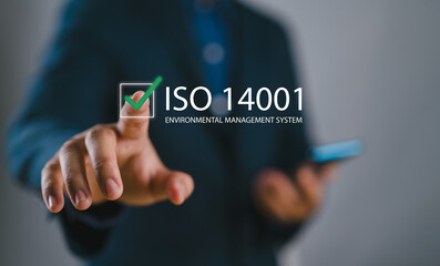 ISO 14001 concept. Identify, control and reduce the environmental impact of activities. Businessman...